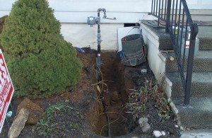 A trench and line ready for the new meter.