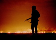 - FILE PHOTO 26FEB91 - A file photo dated February 26, 1991 of a U.S. soldier standing night guard a..